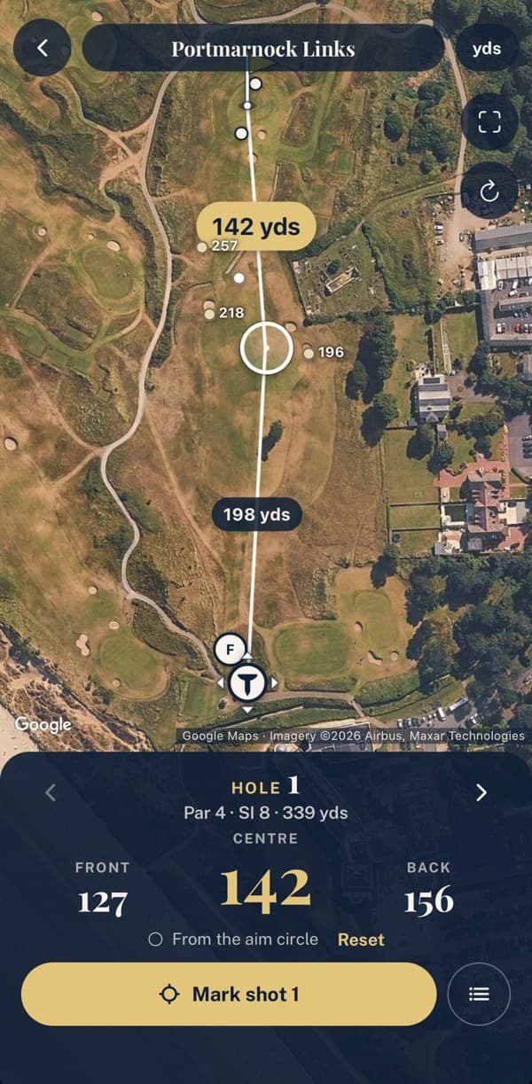 Hole map in the app: satellite view of Portmarnock Links hole 1 with yardages to the aim circle and green